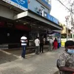 Grocery supplies disrupted; long queues at shops; some residents volunteer to ensure 'social distancing' 2 social distancing